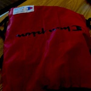 Red, and black champion book bag.